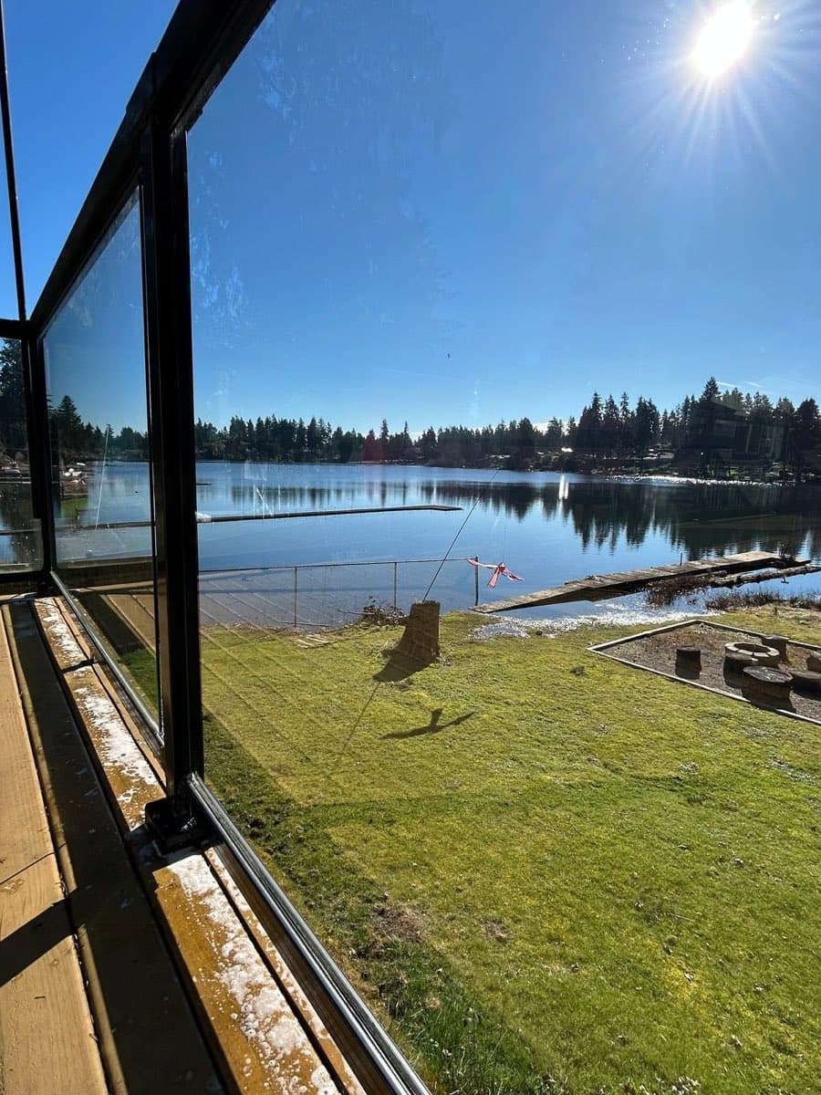 Spotless storefront-style glass with a clear lakeside view